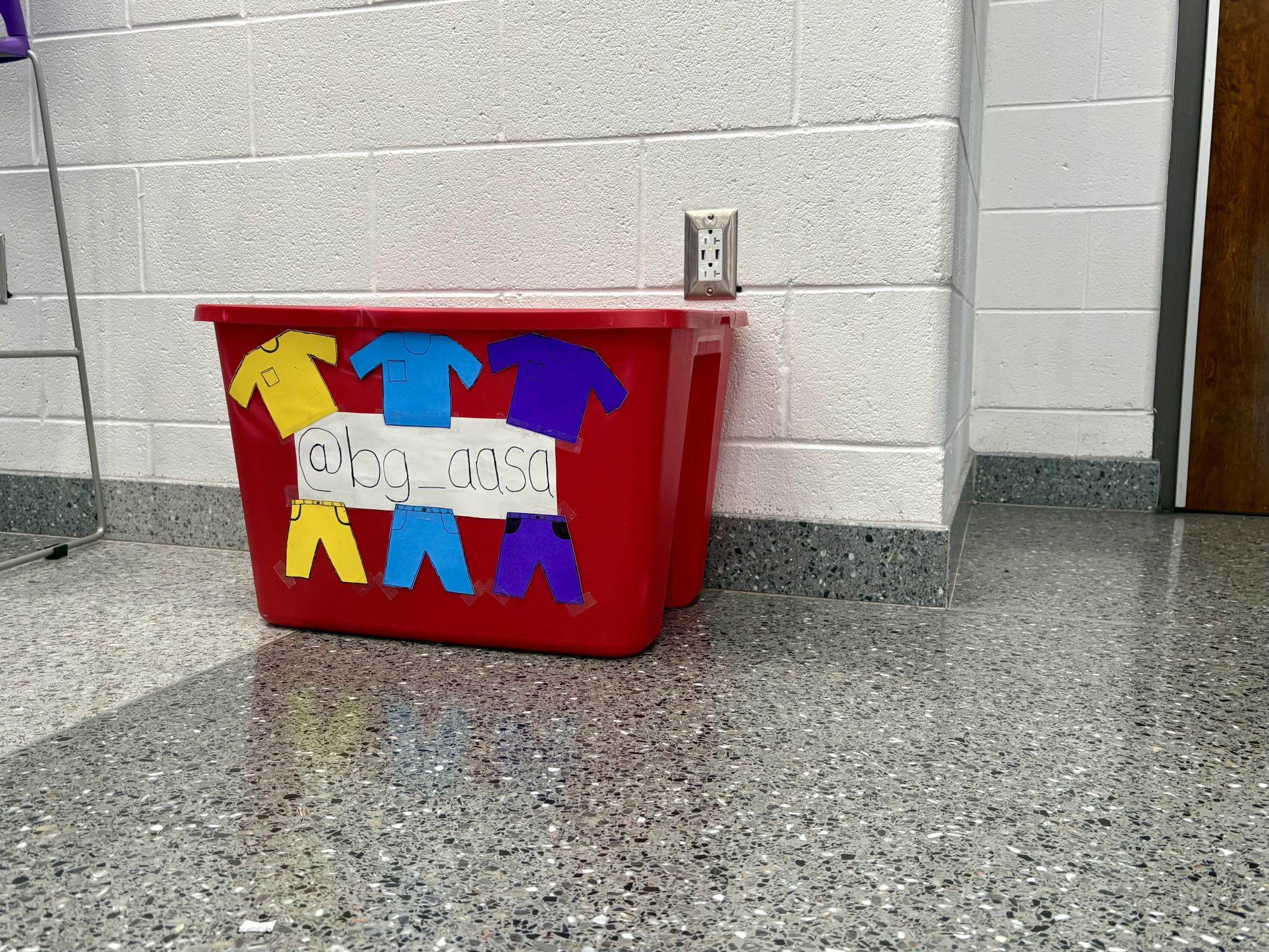 The bin to donate clothes is located in front of the library in the Commons.